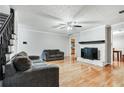 Bright living room featuring hardwood floors and fireplace at 7260 Oswego Trl, Riverdale, GA 30296