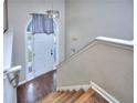 Bright and spacious entryway with hardwood floors and staircase at 8432 Browns Mill Trce, Stonecrest, GA 30038