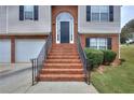 Brick stairs and walkway leading to the front door of the house at 8432 Browns Mill Trce, Stonecrest, GA 30038