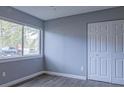 Bedroom with wood-look floors and double-door closet at 3575 Oakvale Rd # 305, Decatur, GA 30034