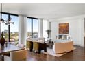 Elegant living room with a curved sofa, fireplace, and stunning city views at 3107 Peachtree Ne Rd # 1502, Atlanta, GA 30305