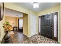 Bright entryway with dark hardwood floors and access to living room at 3579 Oakshire Se Way, Atlanta, GA 30354