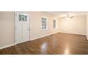 Bright living room featuring hardwood floors and neutral walls at 3661 Collins Dr, Douglasville, GA 30135
