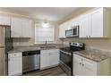 Renovated kitchen with stainless steel appliances at 6677 Songwood Dr, Austell, GA 30168