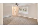 Spacious living room with neutral carpeting and ceiling fan at 796 Vanderbilt Nw Ct, Atlanta, GA 30318