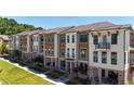 Townhomes with inviting front porches and landscaping at 358 Olmstead Way # 25, Alpharetta, GA 30022