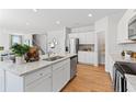 Modern kitchen with white cabinets, granite countertops, and stainless steel appliances at 4175 Viola Pl, Atlanta, GA 30349