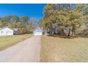 House exterior view showcasing landscaping and driveway at 3360 Brookview Dr, Loganville, GA 30052