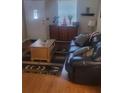 Living room features hardwood floors and leather couch at 2644 Laurel Ln, Kennesaw, GA 30152