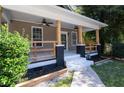 Inviting front porch with wooden posts and railings, perfect for relaxing at 1712 Evans Sw Dr, Atlanta, GA 30310