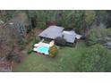 Home with pool and large backyard surrounded by trees at 110 Cove Ln, Social Circle, GA 30025