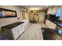 Bright eat-in kitchen with ample cabinet space and tile flooring at 2479 Landeau Cir, Tucker, GA 30084