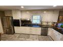 Spacious kitchen features stainless steel appliances and granite countertops at 2479 Landeau Cir, Tucker, GA 30084
