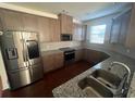 Modern kitchen featuring stainless steel appliances and granite countertops at 602 Lofty Sw Ln, Atlanta, GA 30331