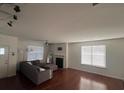Spacious living room with hardwood floors and a fireplace at 602 Lofty Sw Ln, Atlanta, GA 30331