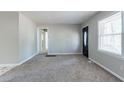 Spacious living room with neutral walls and carpeting at 2196 Swallow Se Cir, Atlanta, GA 30315