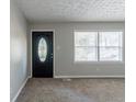 Bright living room with neutral walls, new carpet, and a window at 2196 Swallow Se Cir, Atlanta, GA 30315