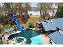 Stunning lakefront property with pool and slide at 2440 Emerald Dr, Jonesboro, GA 30236