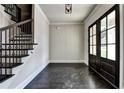 Bright entryway with dark hardwood floors and elegant staircase at 11355 Bennett Ln, Johns Creek, GA 30097