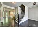Impressive staircase with dark wood and metal railing at 11355 Bennett Ln, Johns Creek, GA 30097