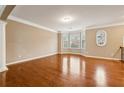 Bright living room with hardwood floors and a large bay window at 1006 Manchester Way, Roswell, GA 30075