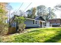 Gray house with modern updates and a spacious lawn at 842 Laurelmont Sw Dr, Atlanta, GA 30311