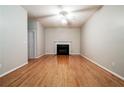 Spacious living room featuring hardwood floors and a fireplace at 2321 Briar Knoll Rd, Lithonia, GA 30058