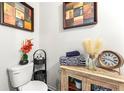 Simple bathroom with toilet and storage cabinet at 1967 Old Dogwood, Jonesboro, GA 30238