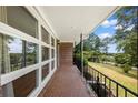 Covered front porch with brick flooring and railing at 416 Carroll Rd, Villa Rica, GA 30180