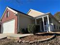 Front view of a charming house with a two-car garage at 4628 Rolling Brook Ct, Union City, GA 30291