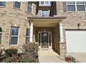 Inviting front entrance with a decorative door and landscaping at 4560 Lake Hill Trl, Ellenwood, GA 30294