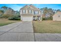 Two-story house with driveway and a spacious lawn at 74 Macland Mill Ln, Dallas, GA 30157