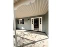 Inviting front porch with white door and black shutters at 2815 Highway 20 Se, Conyers, GA 30013