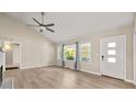 Bright living room with hardwood floors, vaulted ceiling and large windows at 2627 Elsinore St, East Point, GA 30344