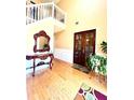 Bright and spacious entryway with hardwood floors and double doors at 408 Othello Dr, Hampton, GA 30228