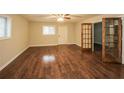 Spacious living room featuring hardwood floors and French doors at 5370 Feldwood Rd, Atlanta, GA 30349