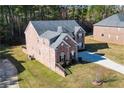 Brick home with a large backyard and side yard at 168 Waypoint Dr, Stockbridge, GA 30281