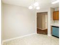 Light and airy dining area with light flooring and access to kitchen at 3347 Waldrop Trl, Decatur, GA 30034