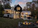 Luxury home with a pool, fire pit, and expansive backyard at 2716 Ridgewood Nw Rd, Atlanta, GA 30327