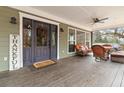 Inviting front porch with seating area, perfect for relaxing outdoors at 4900 Lilburn Stone Mountain Sw Rd, Lilburn, GA 30047