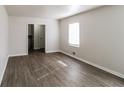 Bright, spacious living room with wood-look flooring and neutral walls at 3900 Emerald North Dr, Decatur, GA 30035
