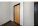 Simple entryway with light wood door and concrete flooring at 426 Marietta Nw St # 209, Atlanta, GA 30313