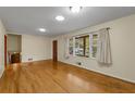 Spacious living room featuring hardwood floors and ample natural light at 4081 Menlo Dr, Tucker, GA 30084