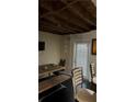 Small dining area with a wooden table and chairs near the kitchen at 956 Oakland Sw Dr, Atlanta, GA 30310