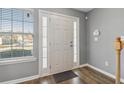 Bright entryway with hardwood floors and neutral walls at 453 Inkberry Dr, Atlanta, GA 30349