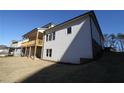 Home's back elevation, showcasing a deck and backyard at 2023 Fern Mountain Ln, Marietta, GA 30064