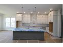 Spacious kitchen, featuring an island and white cabinets at 2023 Fern Mountain Ln, Marietta, GA 30064