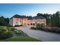 Stunning brick home with a grand entrance and beautifully landscaped grounds at 1513 Jones Rd, Roswell, GA 30075