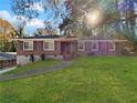 Brick ranch home with a landscaped yard at 591 Lynn Sw Cir, Atlanta, GA 30311