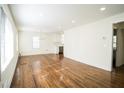 Bright dining room features hardwood floors and chandelier at 921 Byron Sw Dr, Atlanta, GA 30310